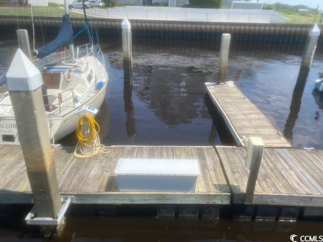 Dock area featuring a water view