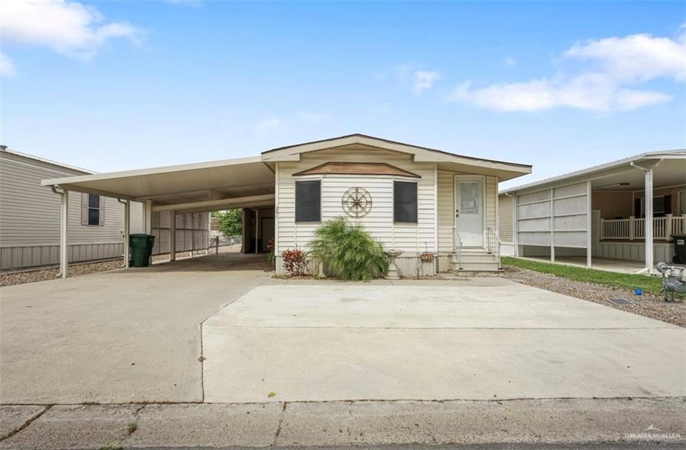 Manufactured / mobile home featuring a carport