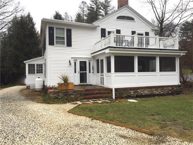 The front door of this 1763 colonial is around the