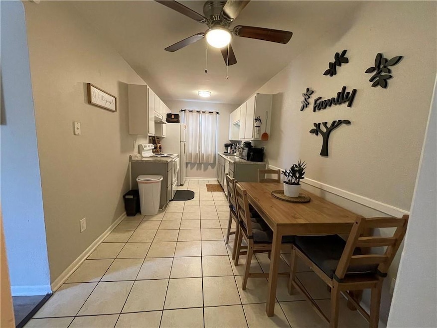 Dining room with light tile patterned floors and 