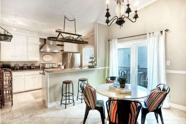 Nice open kitchen with high ceilings and french do