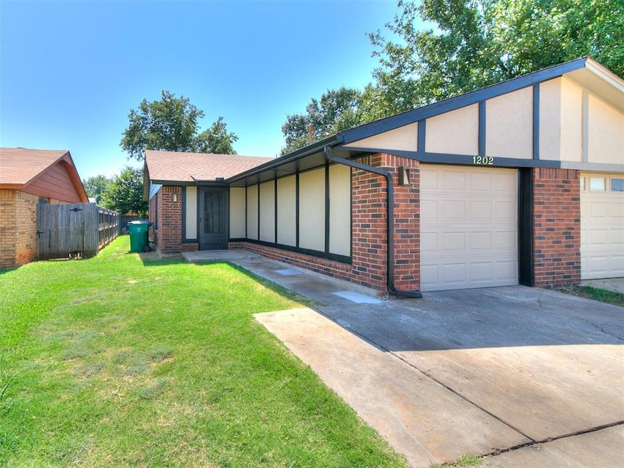 Single story home (half-duplex) with a front yard 