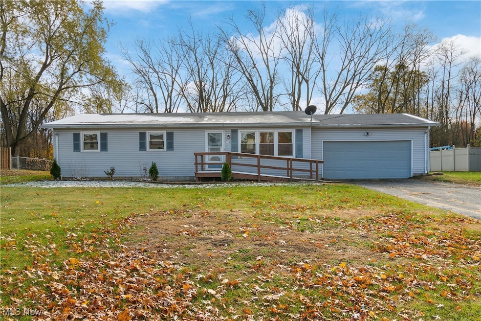 Single story home with a garage and driveway