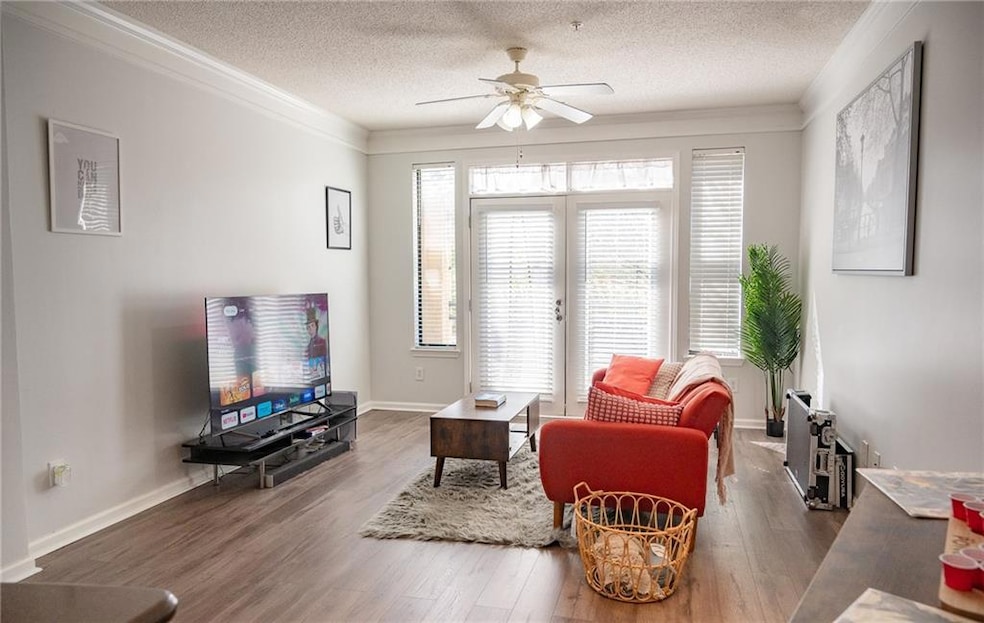 Living room featuring wood-type flooring, ceiling 