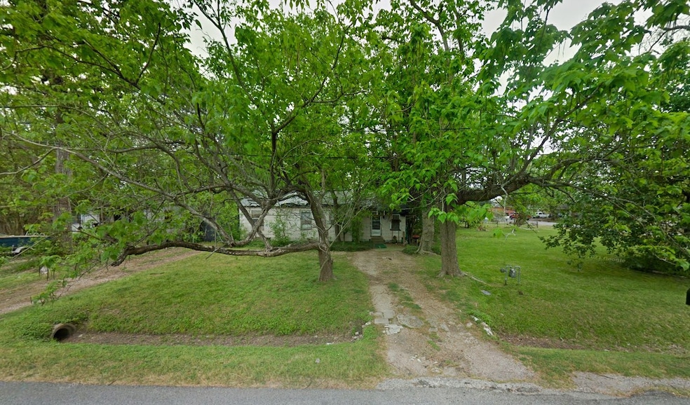 Charming fixer-upper on a spacious lot with mature