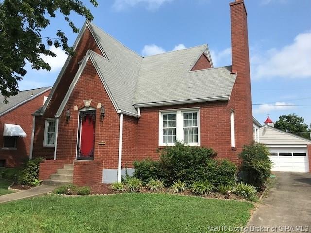 Concrete paved driveway and chimney to wood burning fireplace