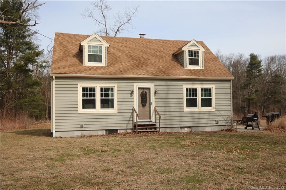 Charming Cape with vinyl siding and newer windows