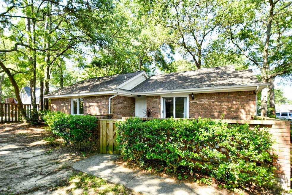 Single story home featuring roof with shingles, br