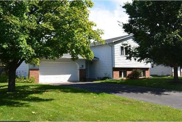 Front of home faces west & is nestled behind a 2 b
