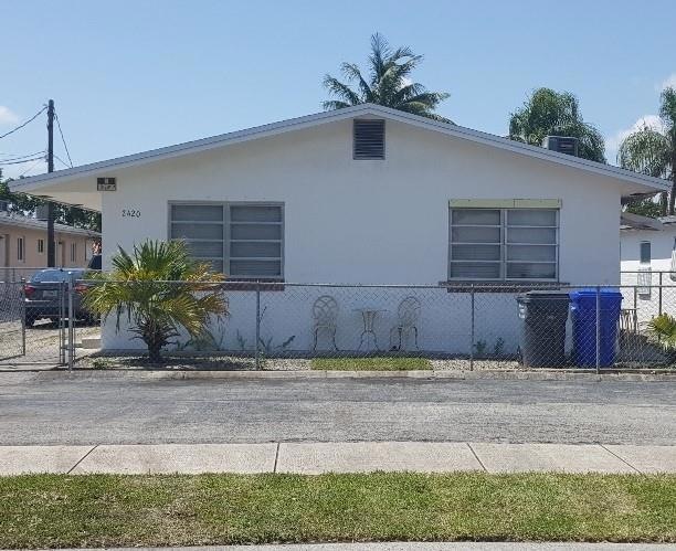 Front of property with 3 parking spots