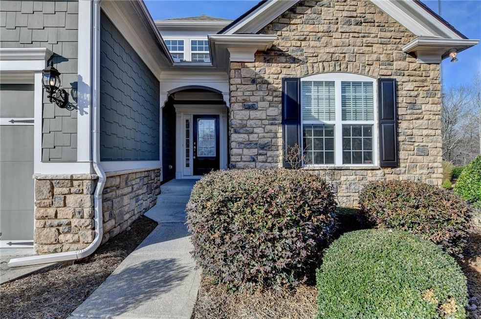 Doorway to property featuring stone siding