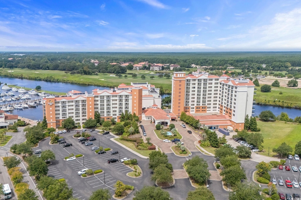 Bird's eye view of a large body of water and apartment complex / building