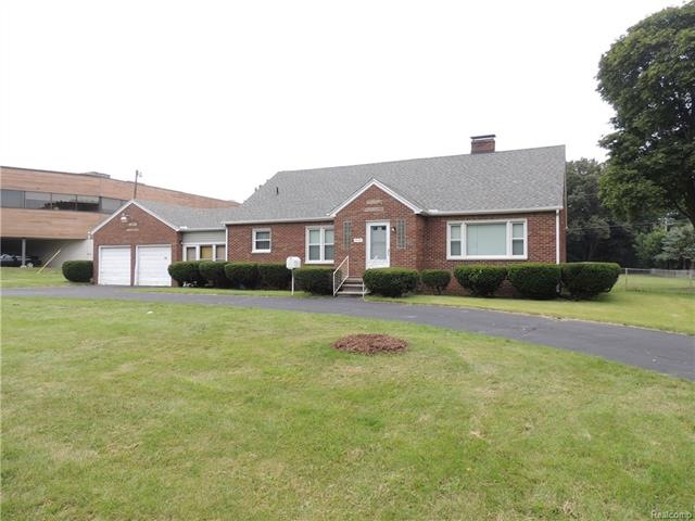 1.25 acres (approx). Zoned office. House is a tear