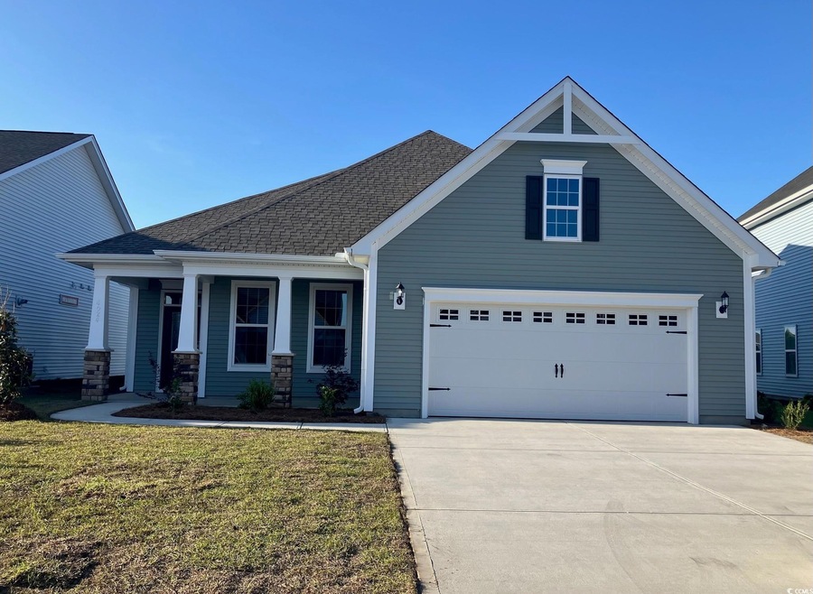 Craftsman-style home with a porch, a shingled roof