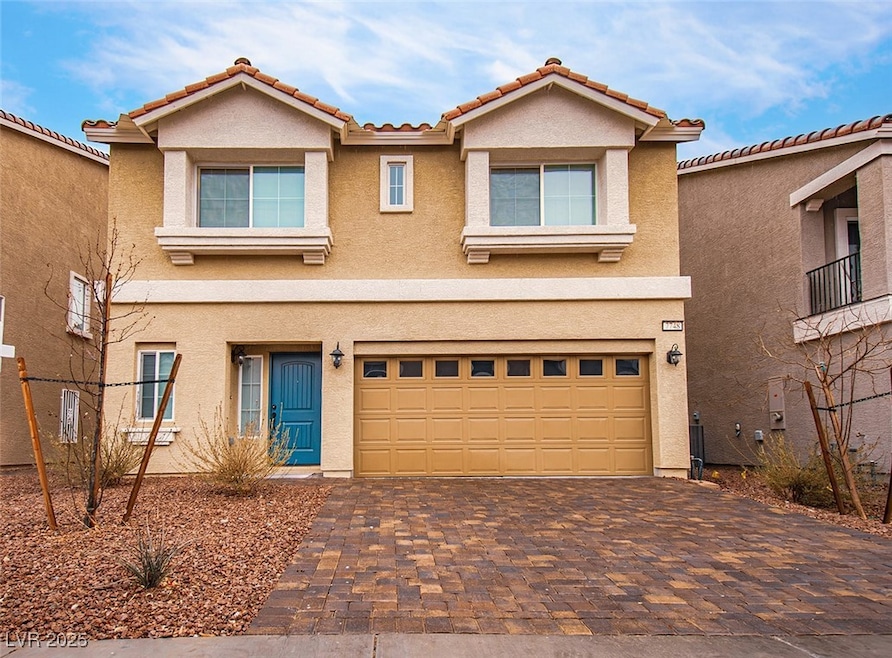 View of front of home featuring fully paved drivew