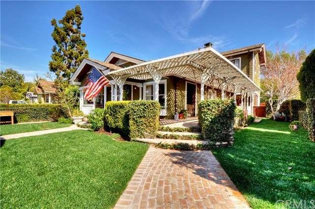 Private corner lot with a grape vine trellis and w