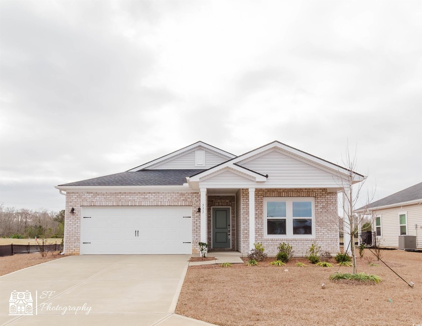 View of front facade featuring central AC unit and
