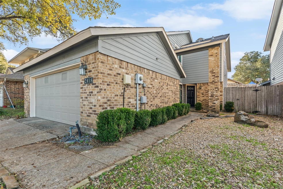 View of property exterior featuring a garage