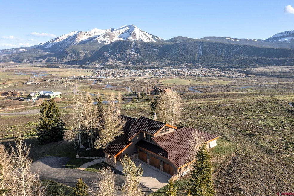 View over house looking south down valley