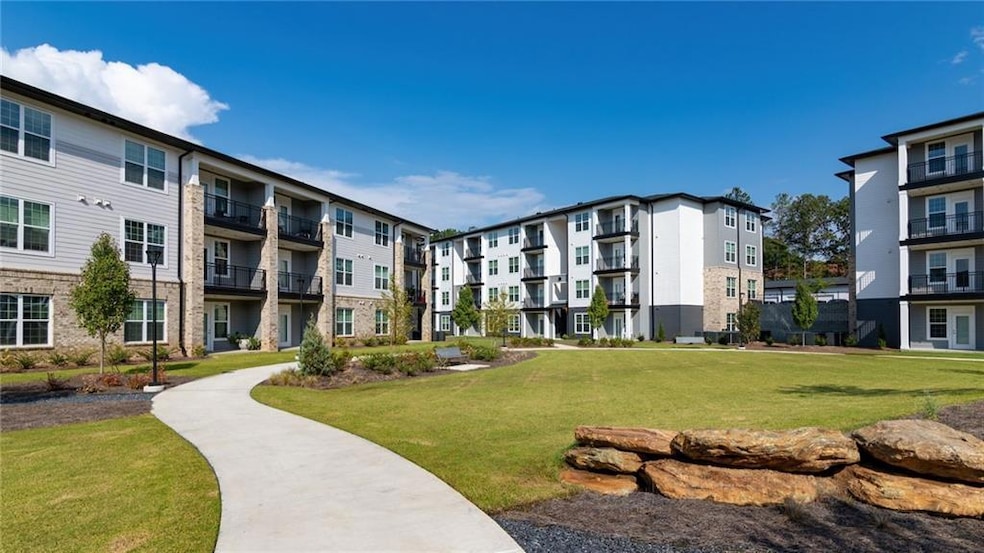 View of home's community featuring a lawn