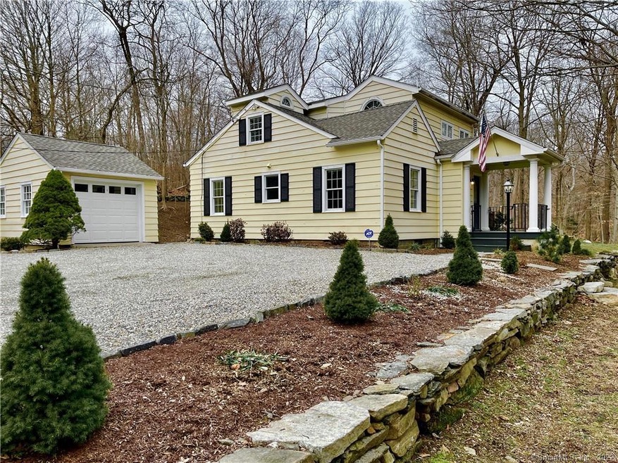 Gravel driveway flank by snow walls and profession