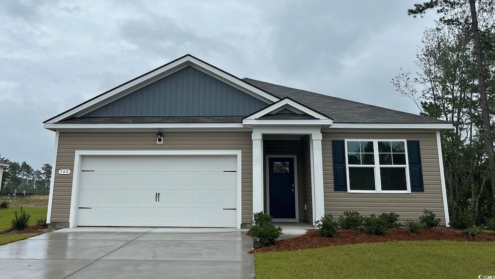 View of front of property with driveway, a garage, and roof with shingles