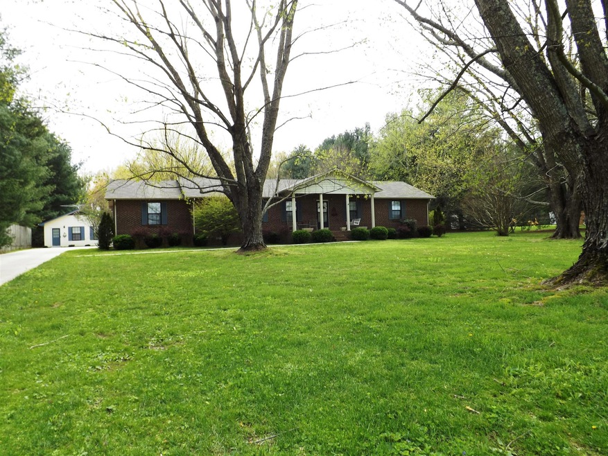 Beautiful 4 BR brick on 2.33 acres in New Union. No city taxes.