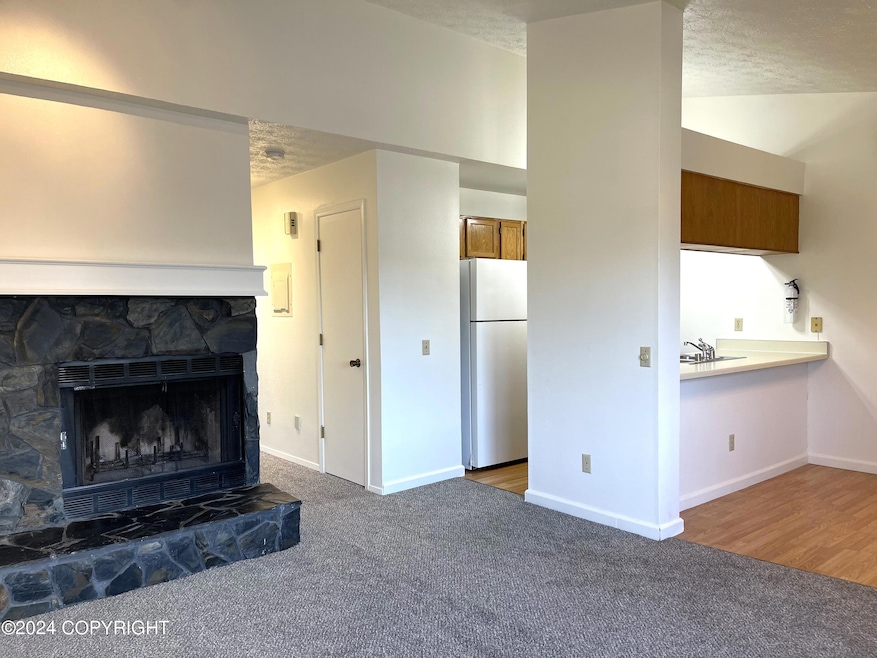 Fireplace, kitchen & dining area