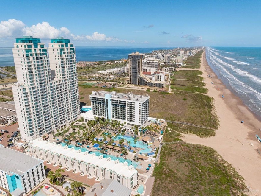 Aerial view with a water view and a beach view