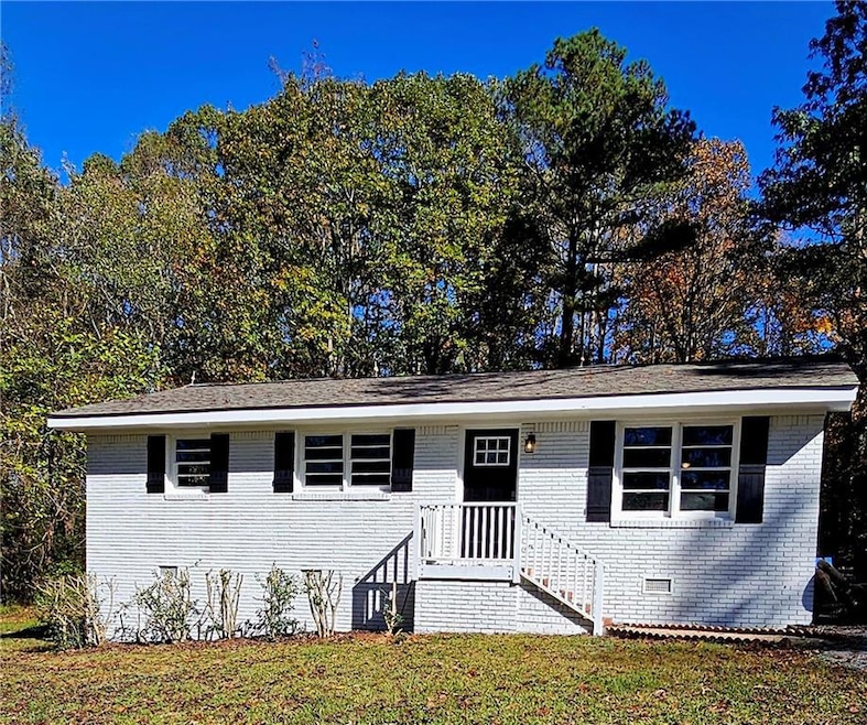 Front of brick house with large lot