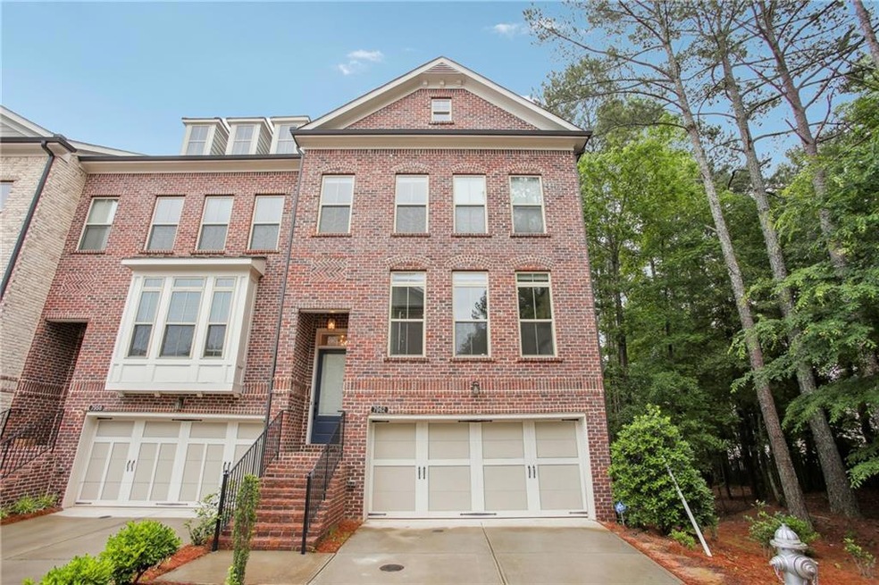 View of property featuring a garage