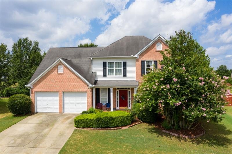 Beautiful landscaped brick and vinyl two story.