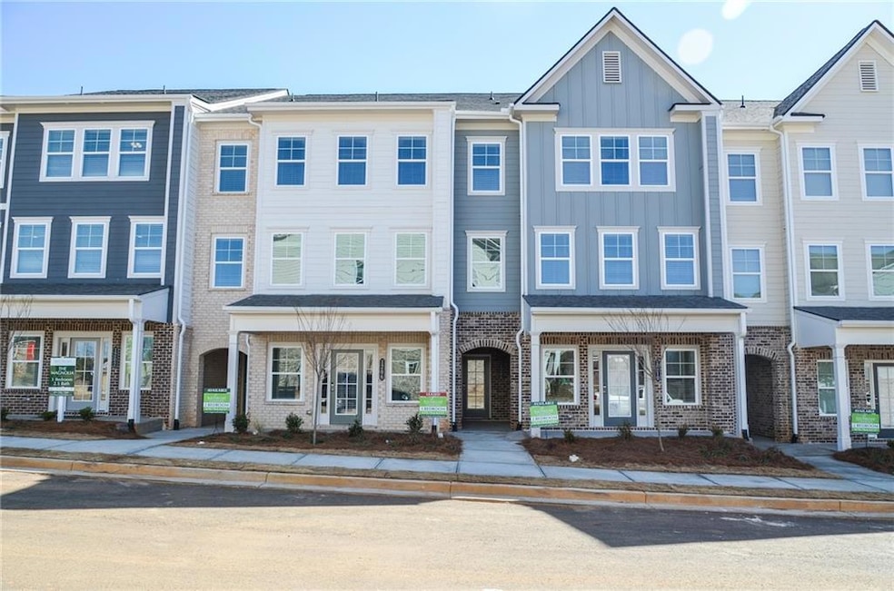 Townhome / multi-family property with brick siding