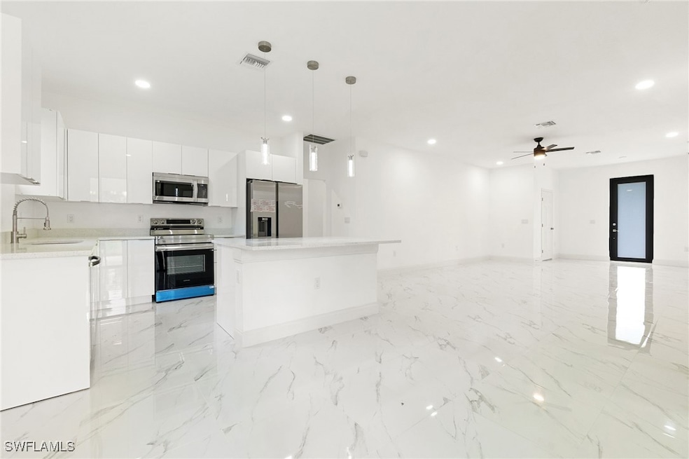 Kitchen with appliances with stainless steel finis