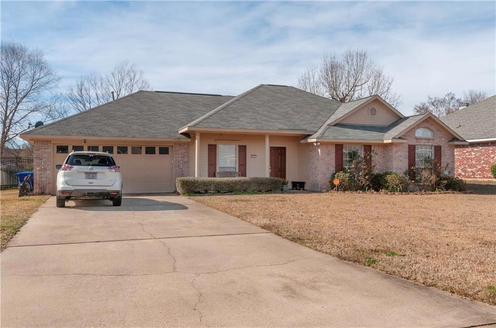 Brick with 2 car garage~front porch~sprinkler syst
