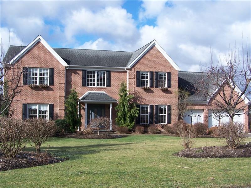Exterior Front with 3 car attached garage & level 
