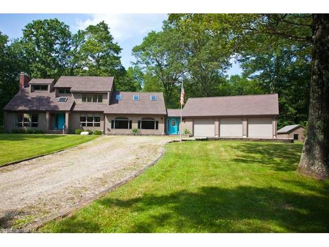 Exterior Front. Lovely Contemporary  in Wooded Set