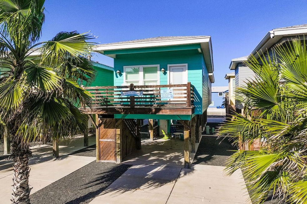 Beach home with a carport and concrete driveway