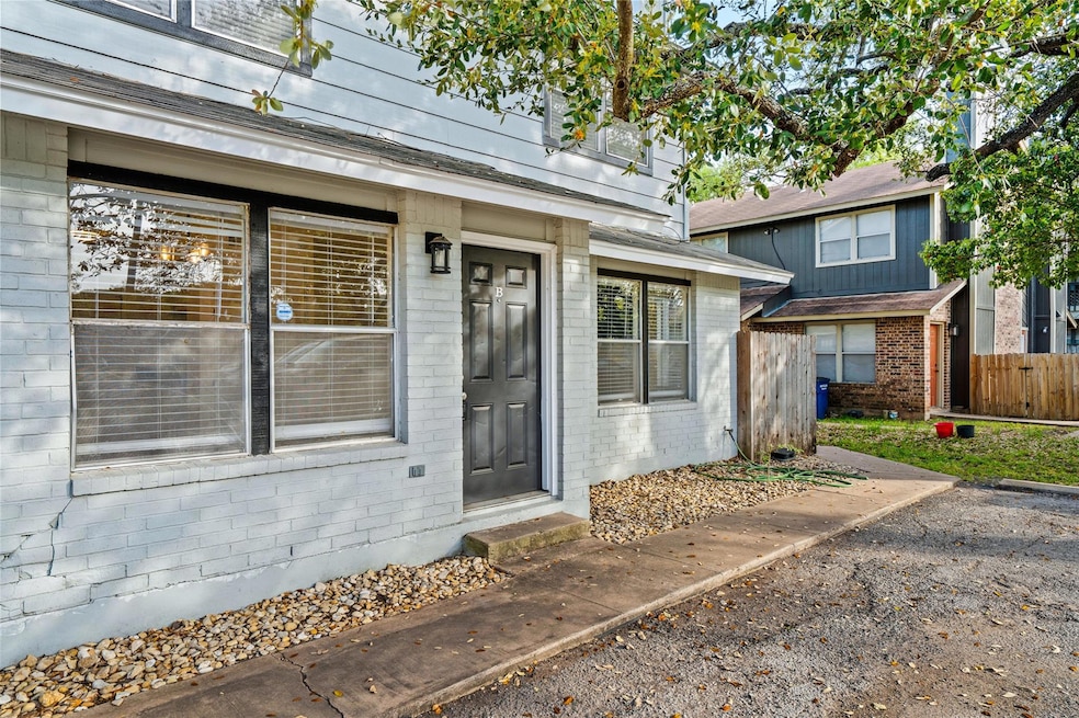 View of exterior entry featuring brick siding and