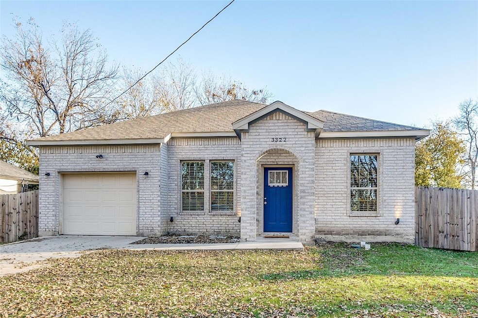 View of front of property featuring a garage and a
