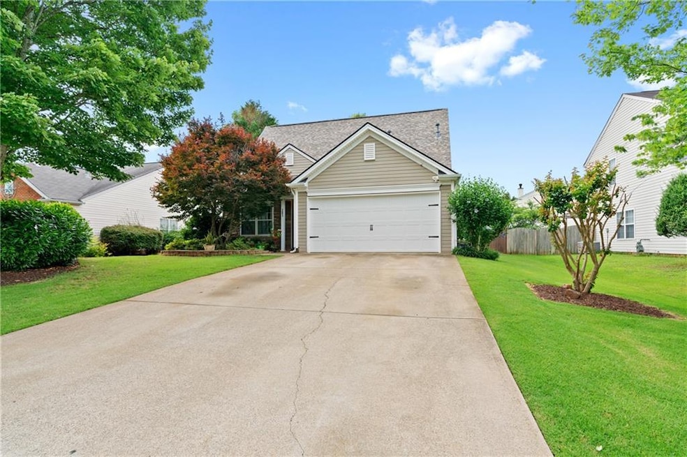 View of front of house featuring a garage and a fr