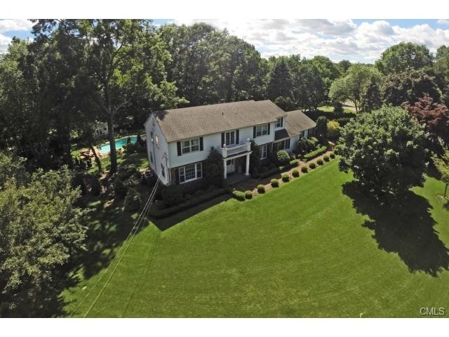 Aerial of front with sweeping lawn