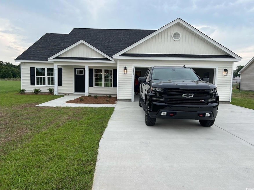 View of front of property with a garage and a fron