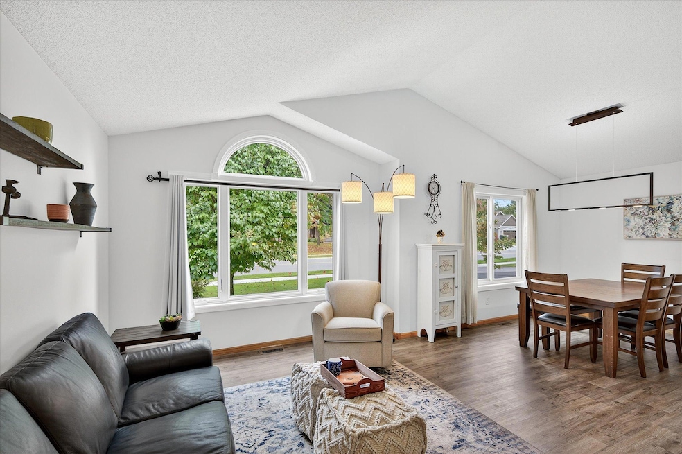 Vaulted ceilings and abundant natural light create a warm, open living space.