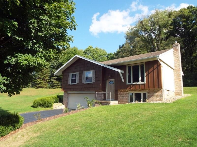 This immaculately maintained split entry has cedar