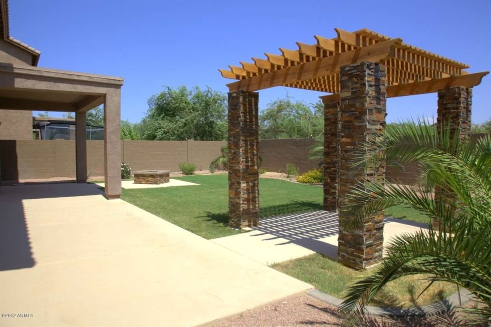 backyard patio is full width of house