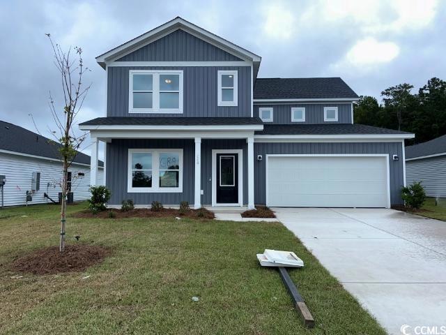 View of front of property featuring a garage, a fr