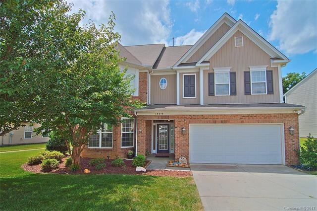 Stunning 3 Story Home partial brick home with unim