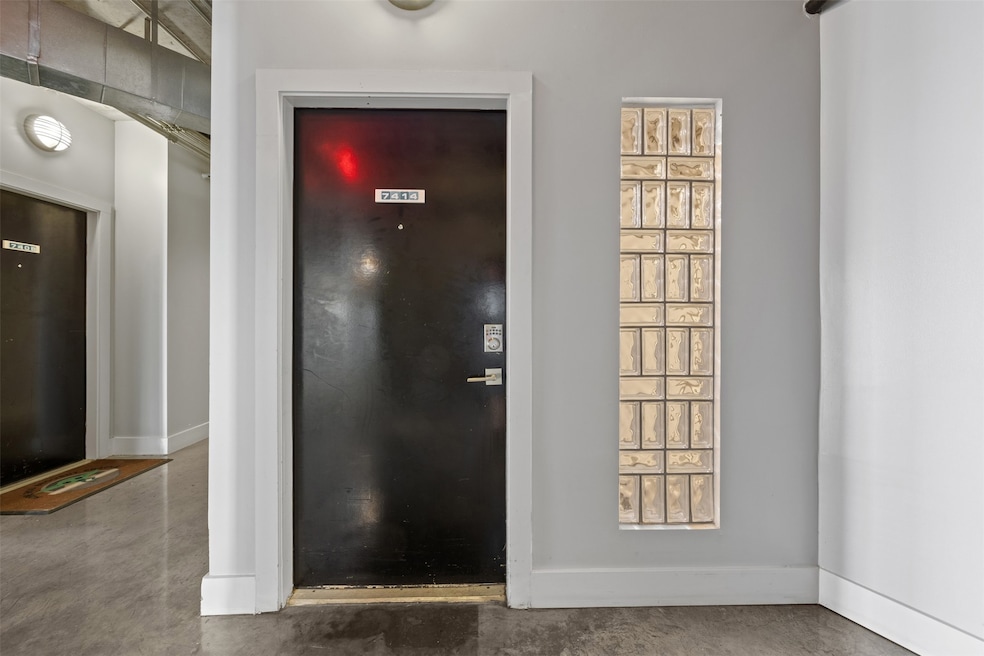 A sleek, industrial-style entryway with a bold bla