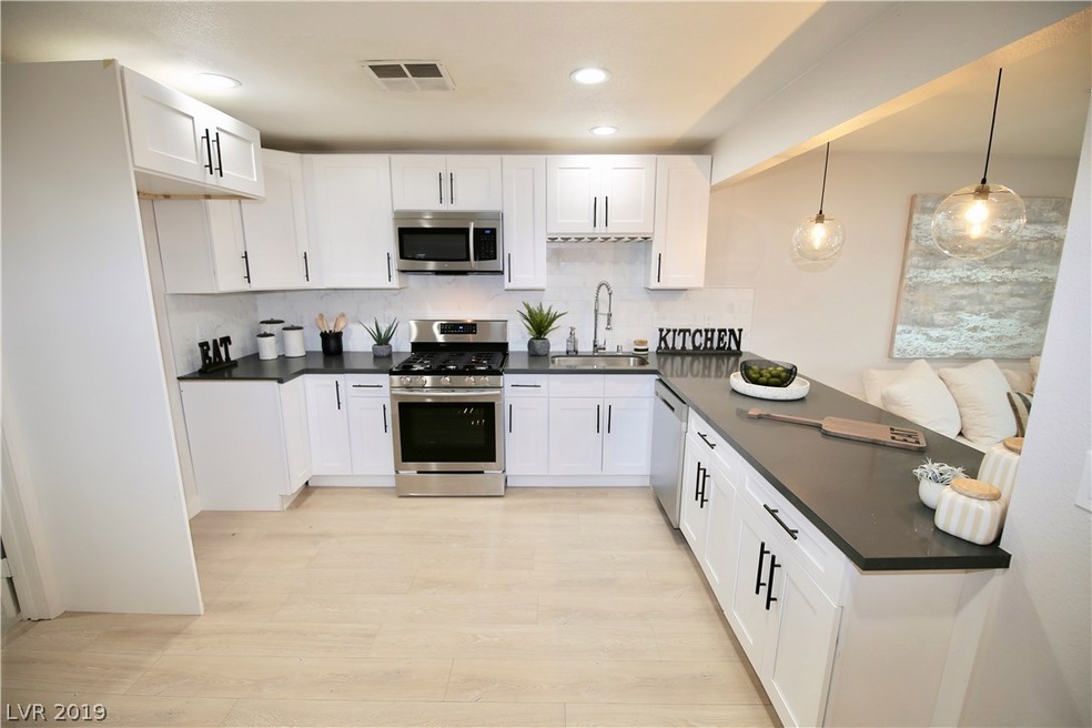 Brand new white shaker cabinets, concrete grey qua
